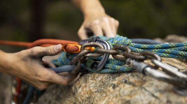 Climber checking climbing ropes