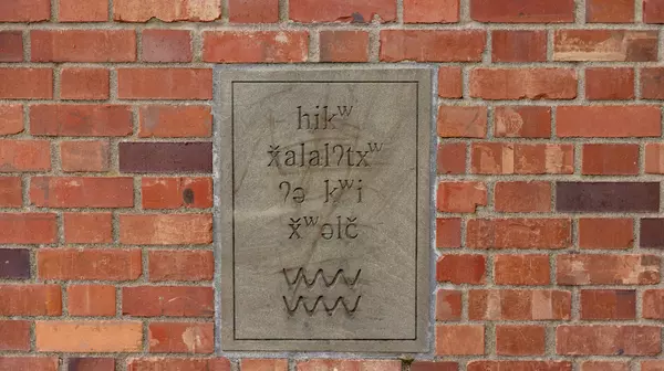 Signs at the Alder Street campus entrance on North 15th Street celebrate teh Lushootseed language