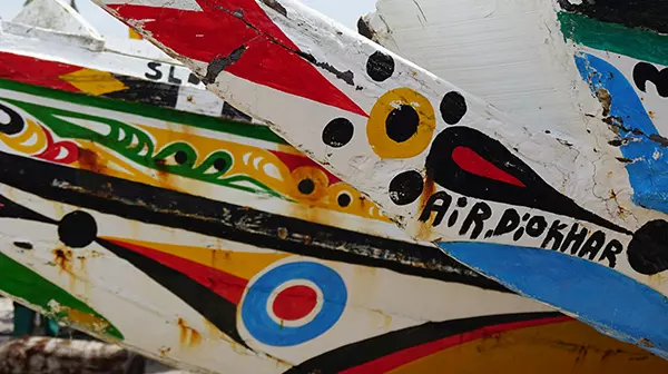 Colorful boats in Dakar, Senegal. Photo by Carles Martinez on Unsplash