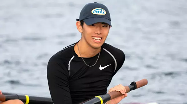 Image of student sitting in racing shell for crew