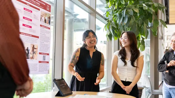 Graduate students presenting at OT symposium on campus