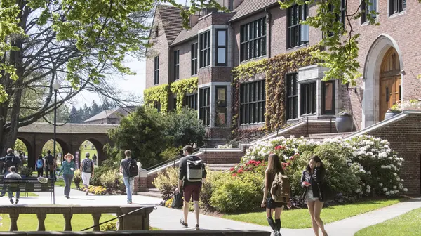 Students walk by historic Jones Hall.