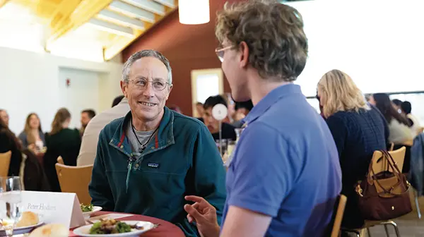 Attendees talk at the CES Dinner with Strangers event