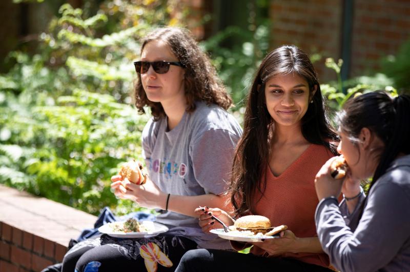 Students enjoy lunch outside on campus.