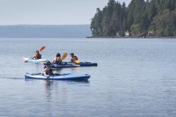 Students kayaking in the sound