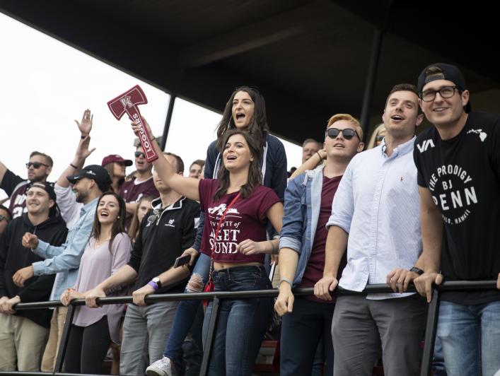 ans cheer on as Puget Sound competes against Pacific Lutheran University for the Homecoming and Family Weekend Football Game.