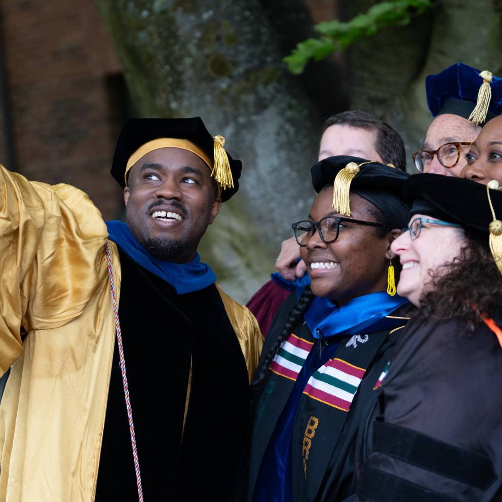 Professors and students celebrate at Commencement 2024.