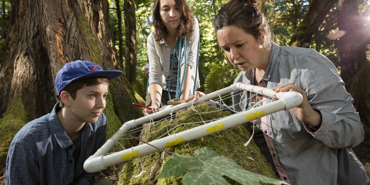 Prof. Carrie Woods does field research with students.