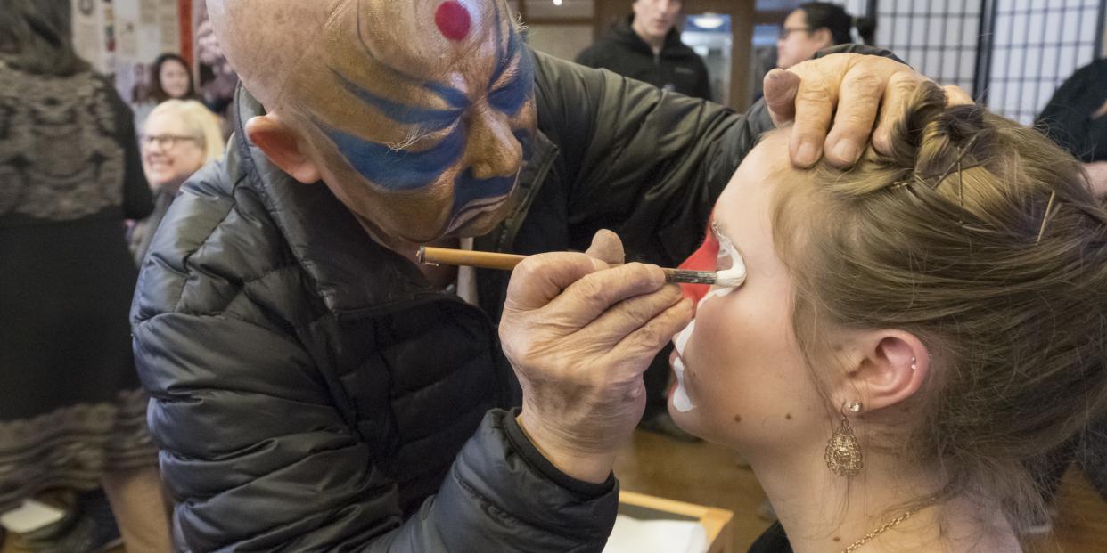 A student gets their face painted during a Lunar New Year celebration.