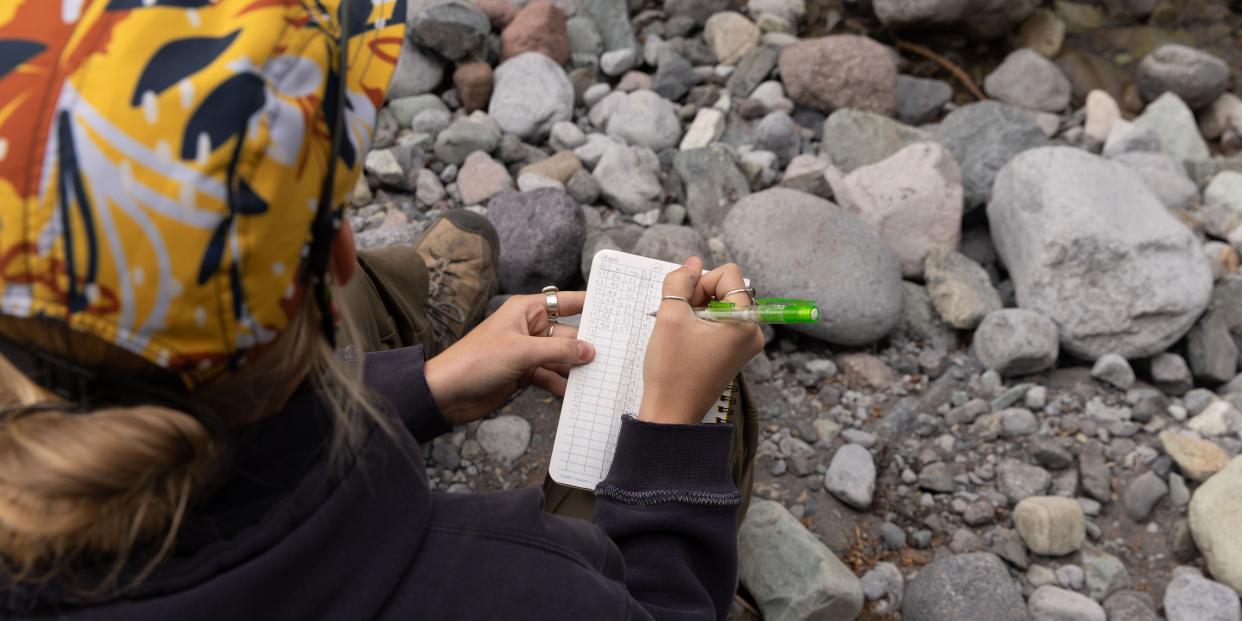 A student does research out in the field.