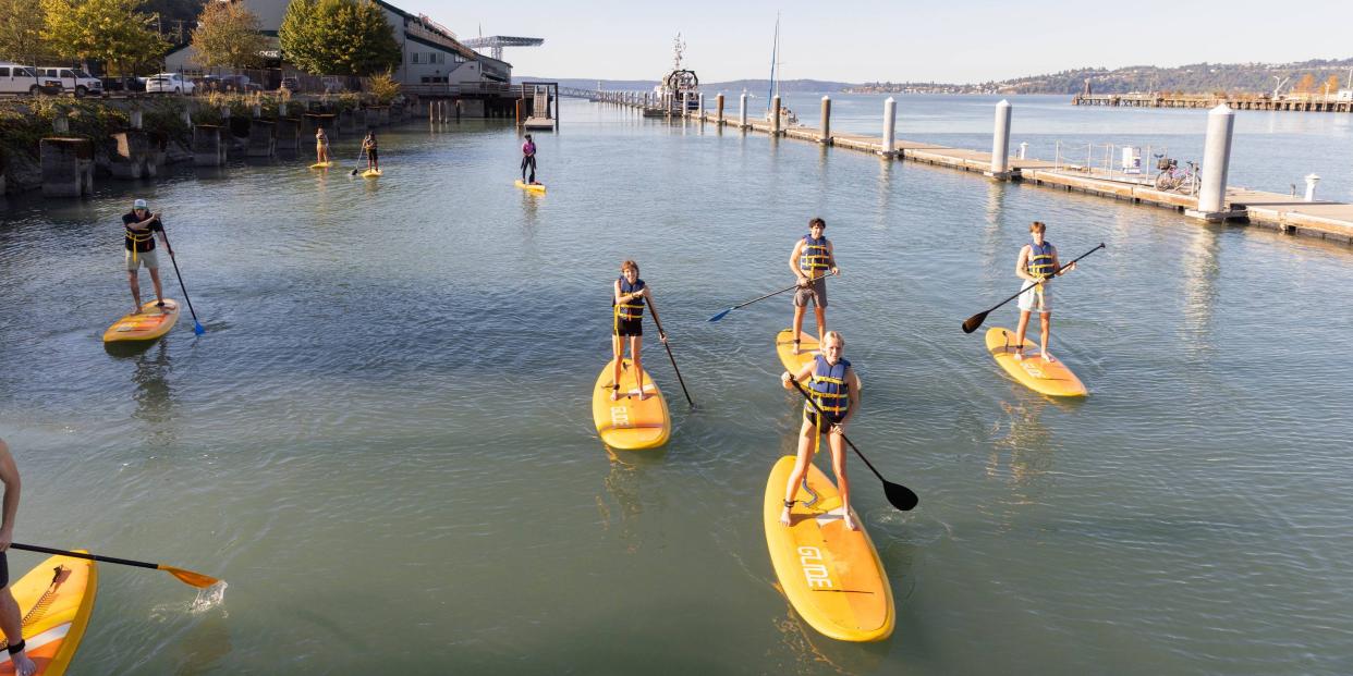 Students on paddleboards in Commencement Bay