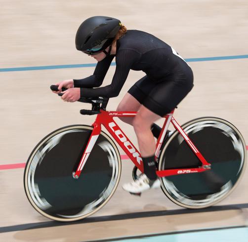 Clara Brown racing on her bike