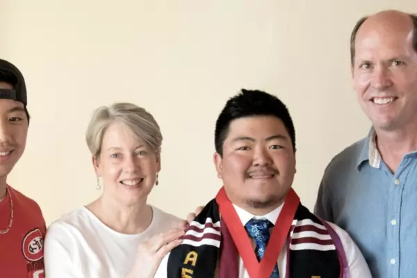 Four people smiling