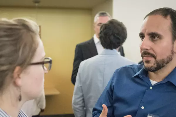 Two people talking at a networking event