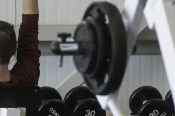 A person in the gym lifting weights