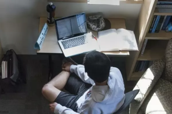 A bird's eye view of a person working on a laptop