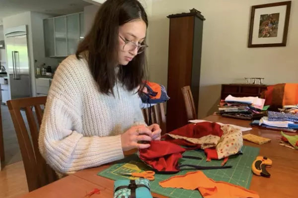 A woman working with sewing materials