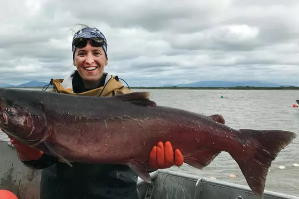 swimmer carrying fish