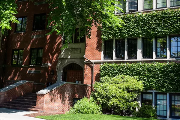 Image of McIntyre building with climbing ivy on the walls.