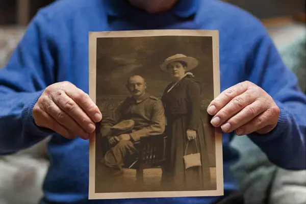 Henry Haas ’60 holding an image of his grandparents