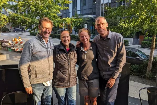 Karen Moore Sales ’92 and Shannon Hughes ’92 with their husbands pre-surgery.
