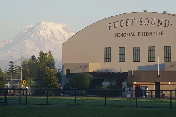 Exterior view of Memorial Fieldhouse with Mt. Rainier in the background. 