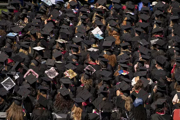 Above look at graduates at a Commencement ceremony. 