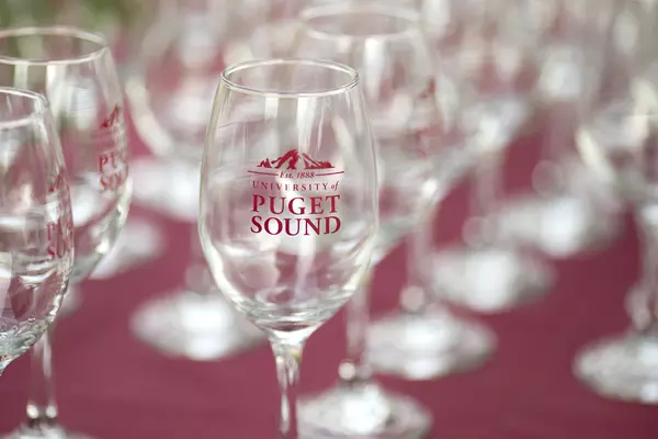 Wine glass with the University of Puget Sound logo