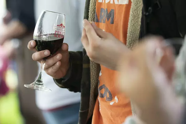 Alum with a wine glass.