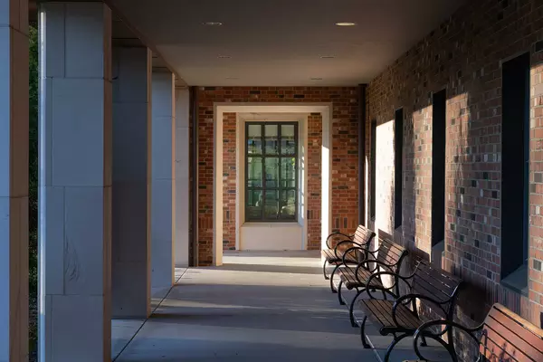 Outdoor hallway with benches