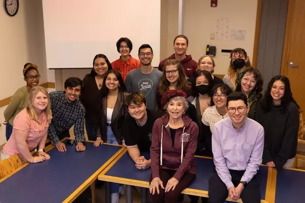Rita Moreno interacts with students of Professor Andrew Gomez in a classroom visit