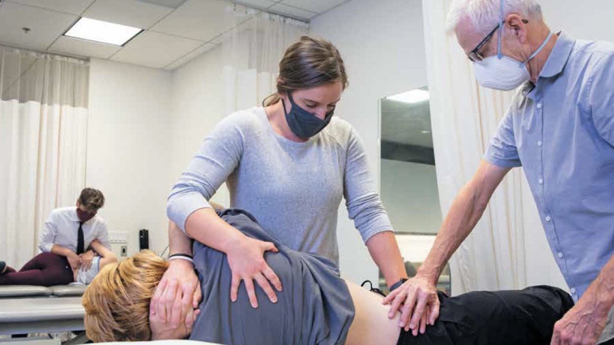 Physical therapists treating a patient