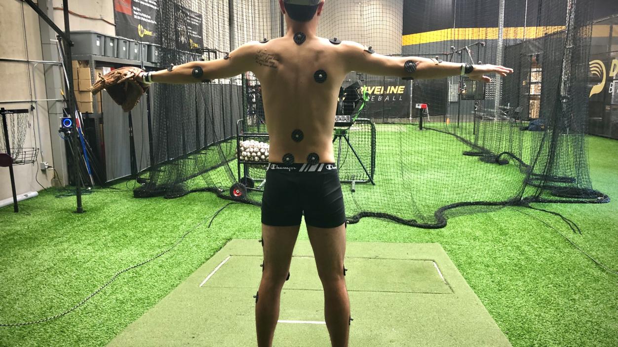 Athlete stands at Driveline Baseball, readying for motion capture filming