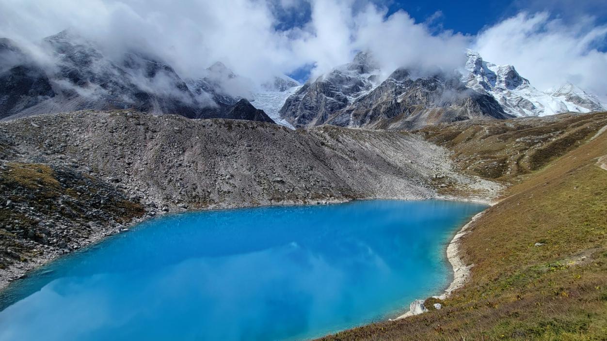 A brilliant blue alpine lake.