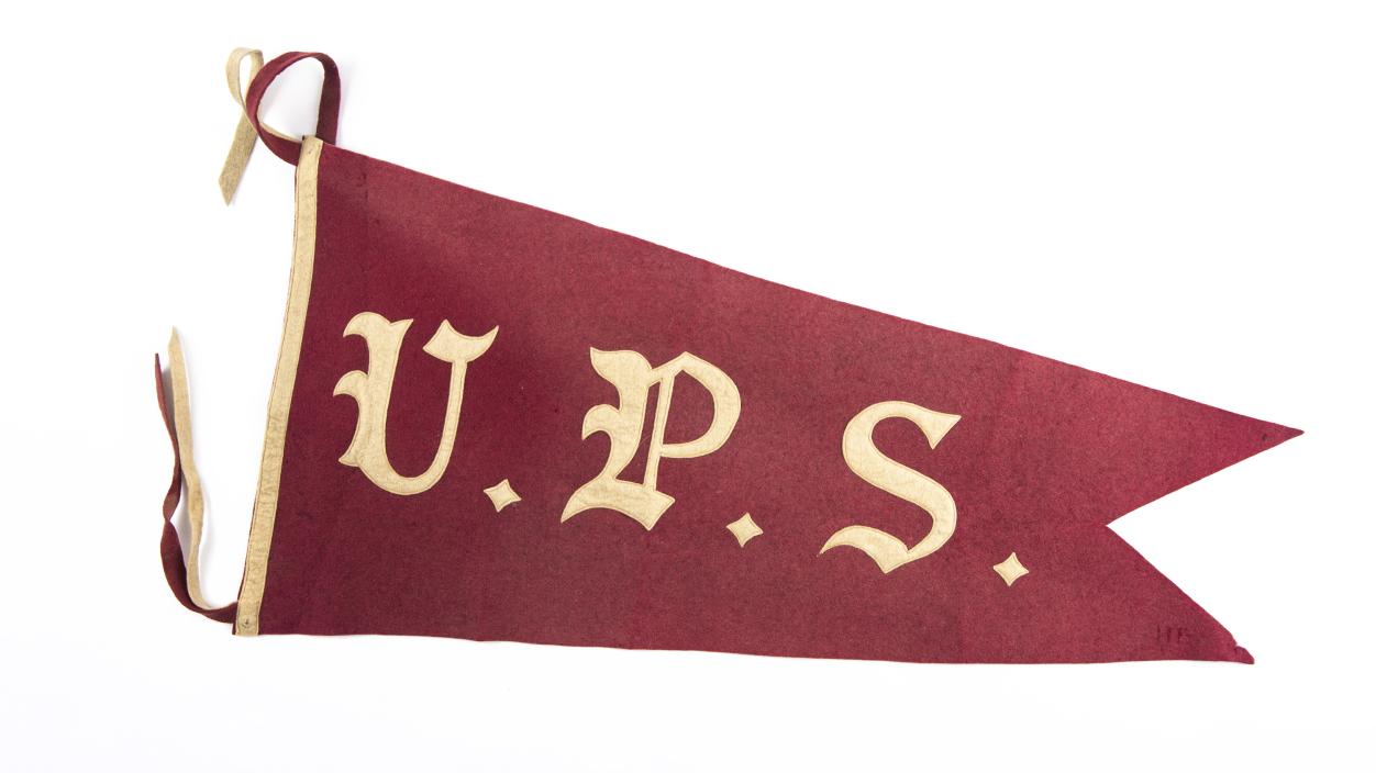 A maroon pennant with the letters "U.P.S." in white.