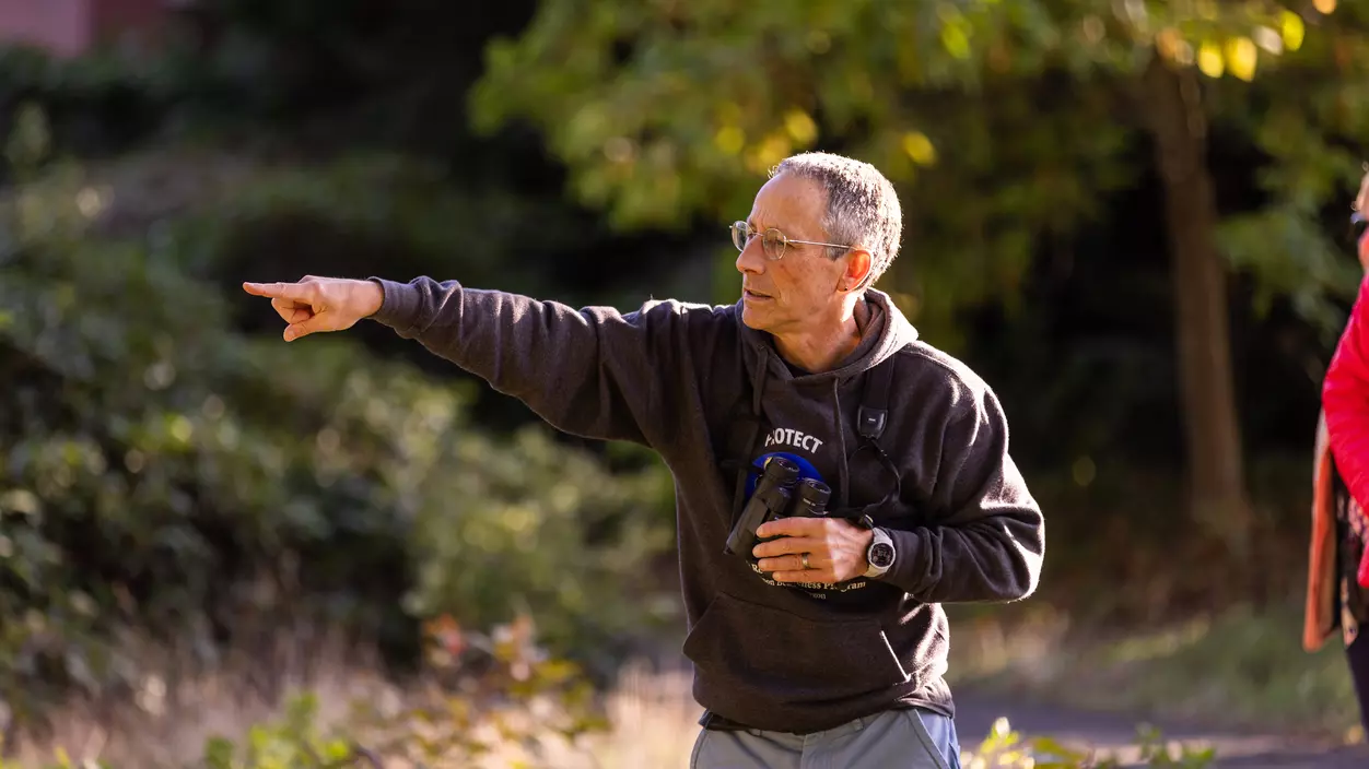 Prof. of Biology Peter Hodum leads a bird watching group on campus.