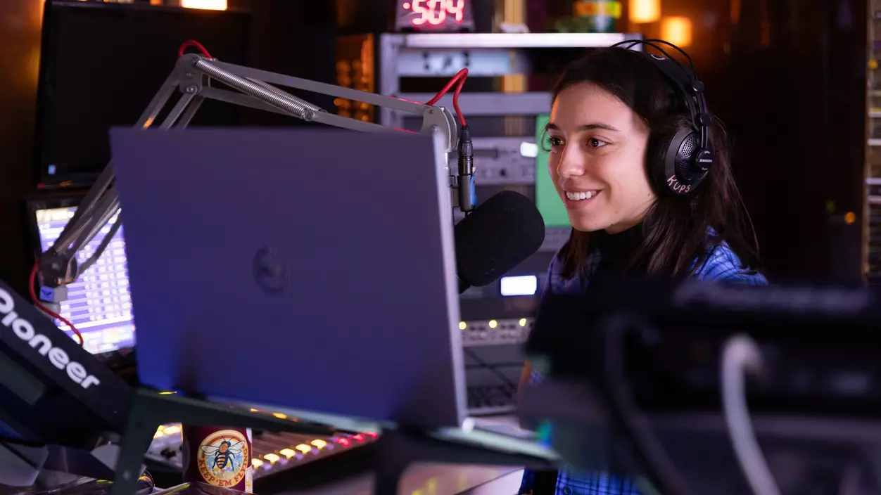 Anna Dery ’27 in the studio at KUPS.