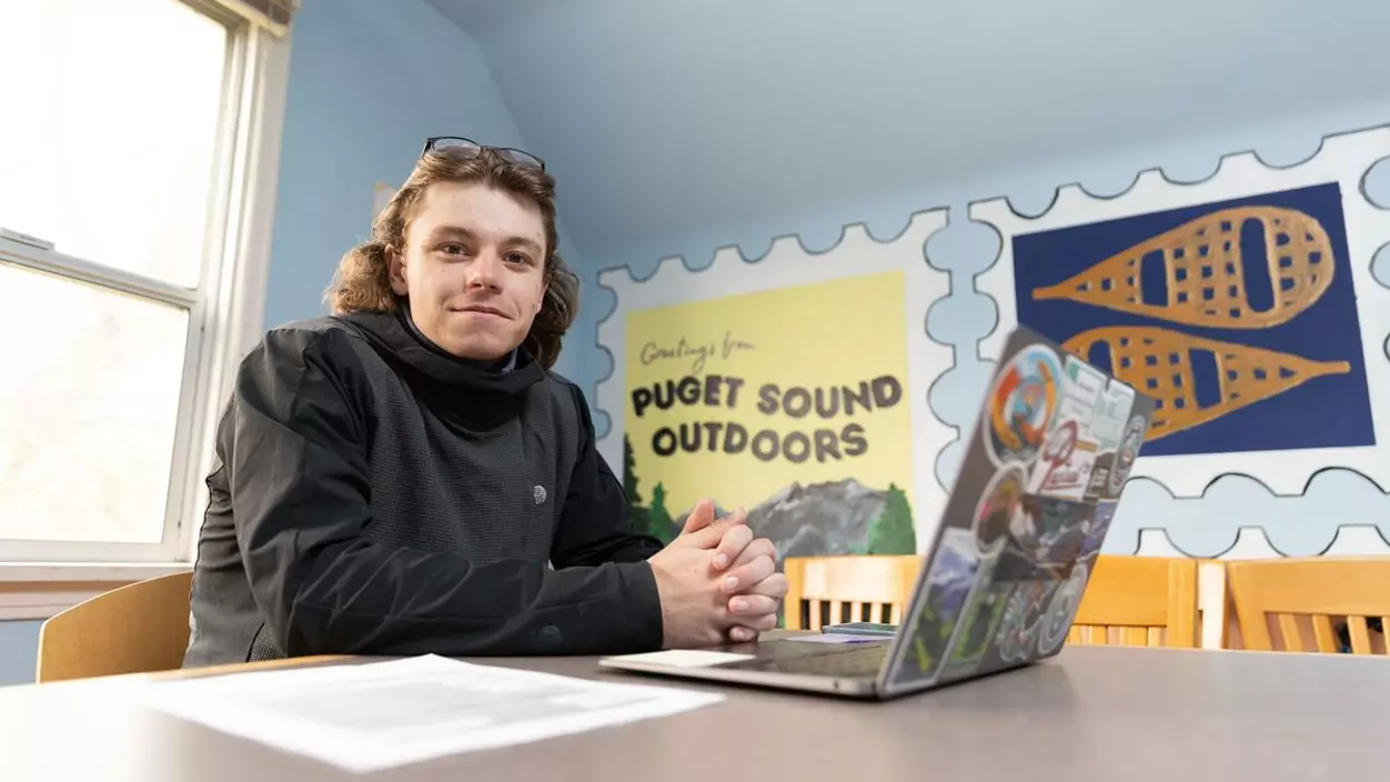 Reggie Westgate ’26 at his desk at Puget Sound Outdoors.