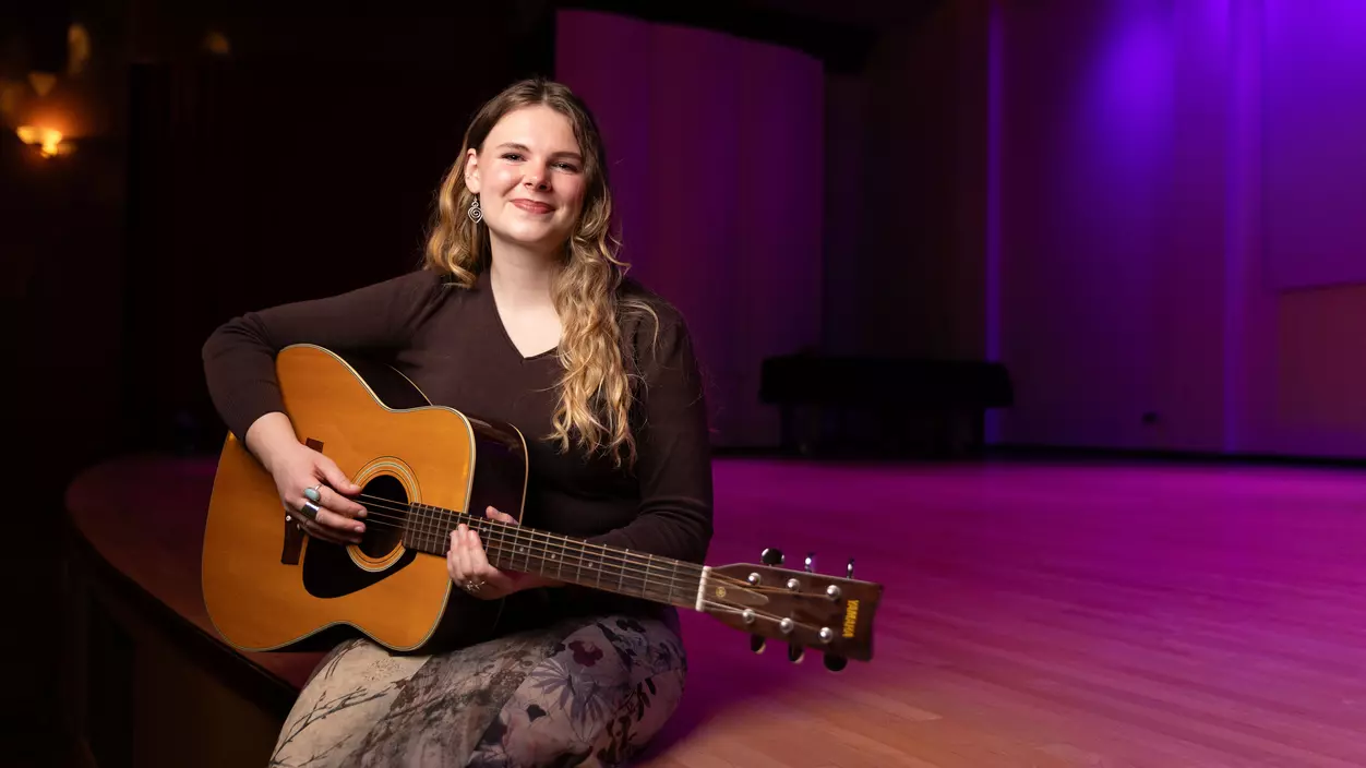 Madison Hening ’26 with her guitar