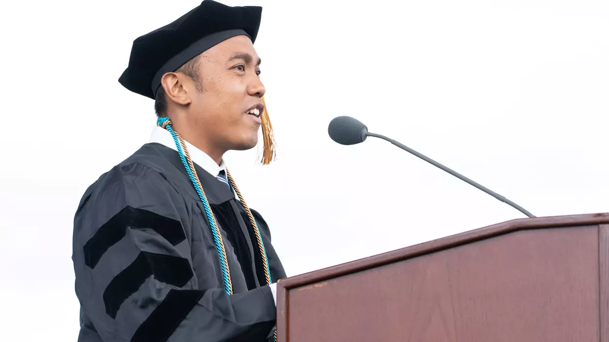 Rovin Ian Antonio ’23, DPT’26 delivers the graduate student address at the Commencement Ceremony on May 10, 2026.