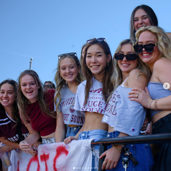 Students from Puget Sound's Greek Life program cheer on Logger football.