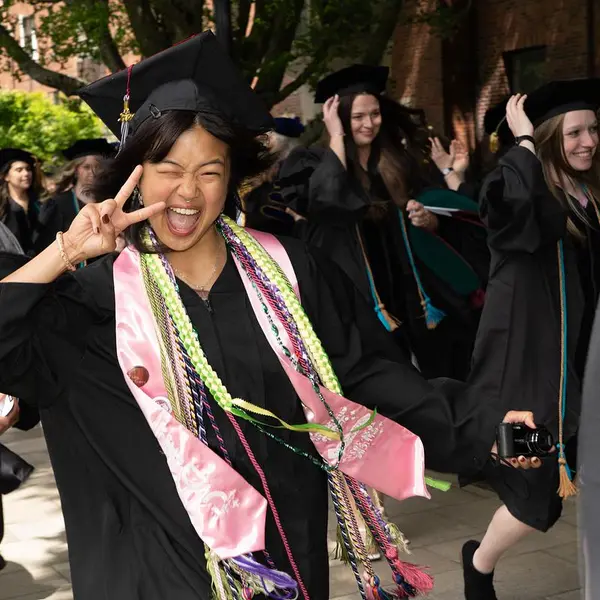 A graduate winks at the camera on Commencement Day 2026.