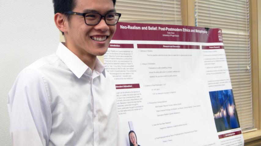 Cody Chun '17 presents at the fall summer research symposium.