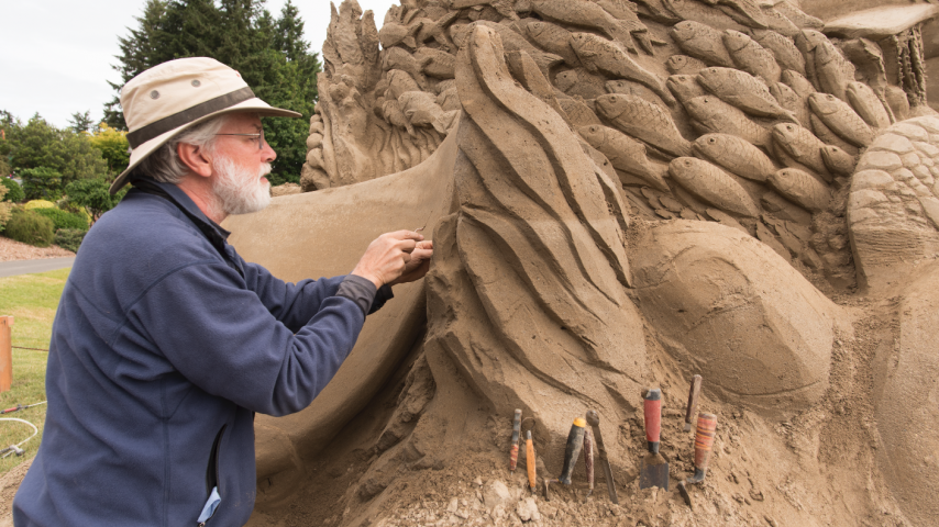 Jeff Strong working on a sand sculpture