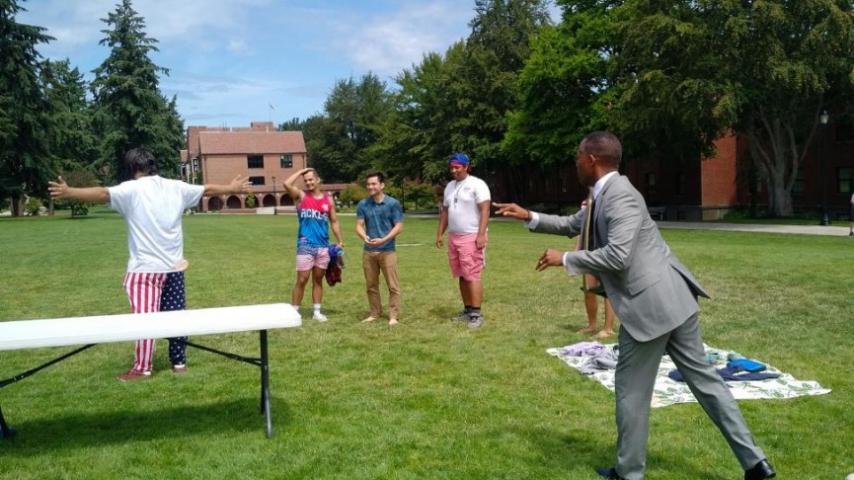 President Crawford helps a few of our Summer Academic Challenge teaching assistants get ready for an epic water balloon fight