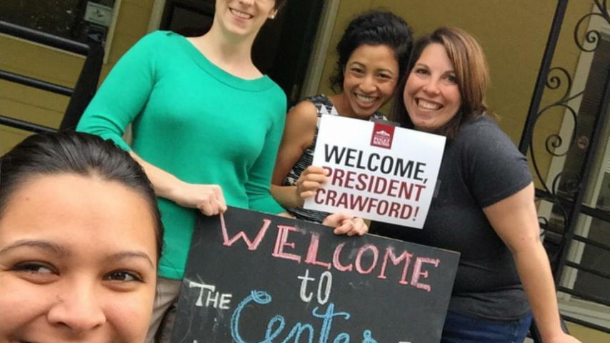Staffers from The Yellow House (Puget Sound's Center for Intercultural and Civic Engagement) welcome President Crawford