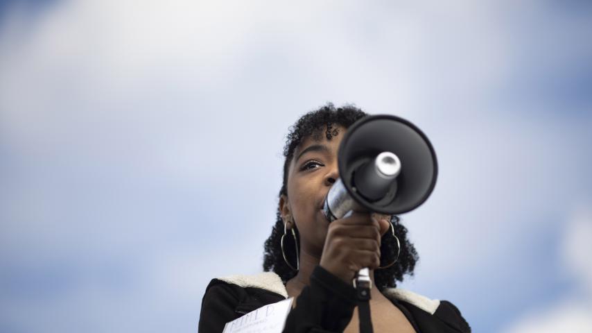 Woman speaking into a megaphone