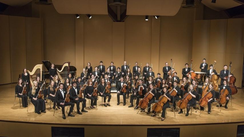 Orchestra performers on stage
