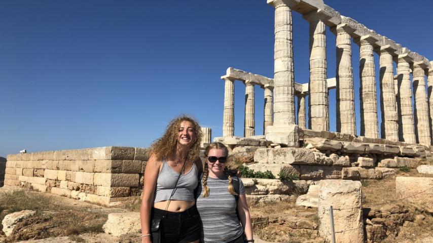 Students posing with ancient ruins