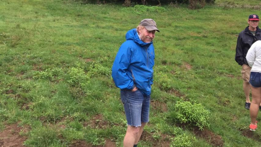 Barry walking in the muddiest field in New Zealand